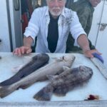 a man holding a fish