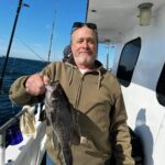 Richard Jesse Watson holding a fish