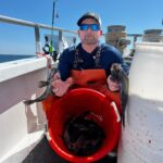 a man riding on the back of a boat