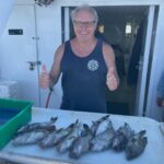 a person holding a fish