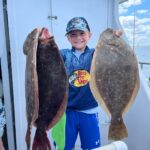 a person holding a fish