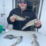 a person holding a fish