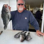 a man holding a fish