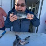 a man holding a fish