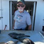 a man holding a fish