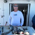 a person holding a fish