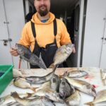 a person holding a fish