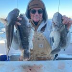 a person holding a fish