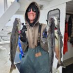 a person holding a fish