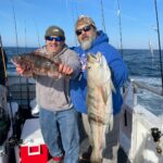 a person holding a fish in the water