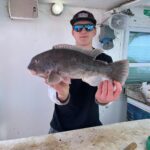 a person holding a fish