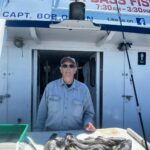 a man standing in front of a building