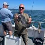 a man standing on a boat in the water