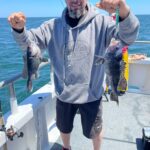 a person holding a fish