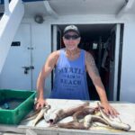 a person standing in front of a boat