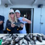 a man and a woman standing in front of a building