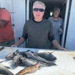 a man holding a fish
